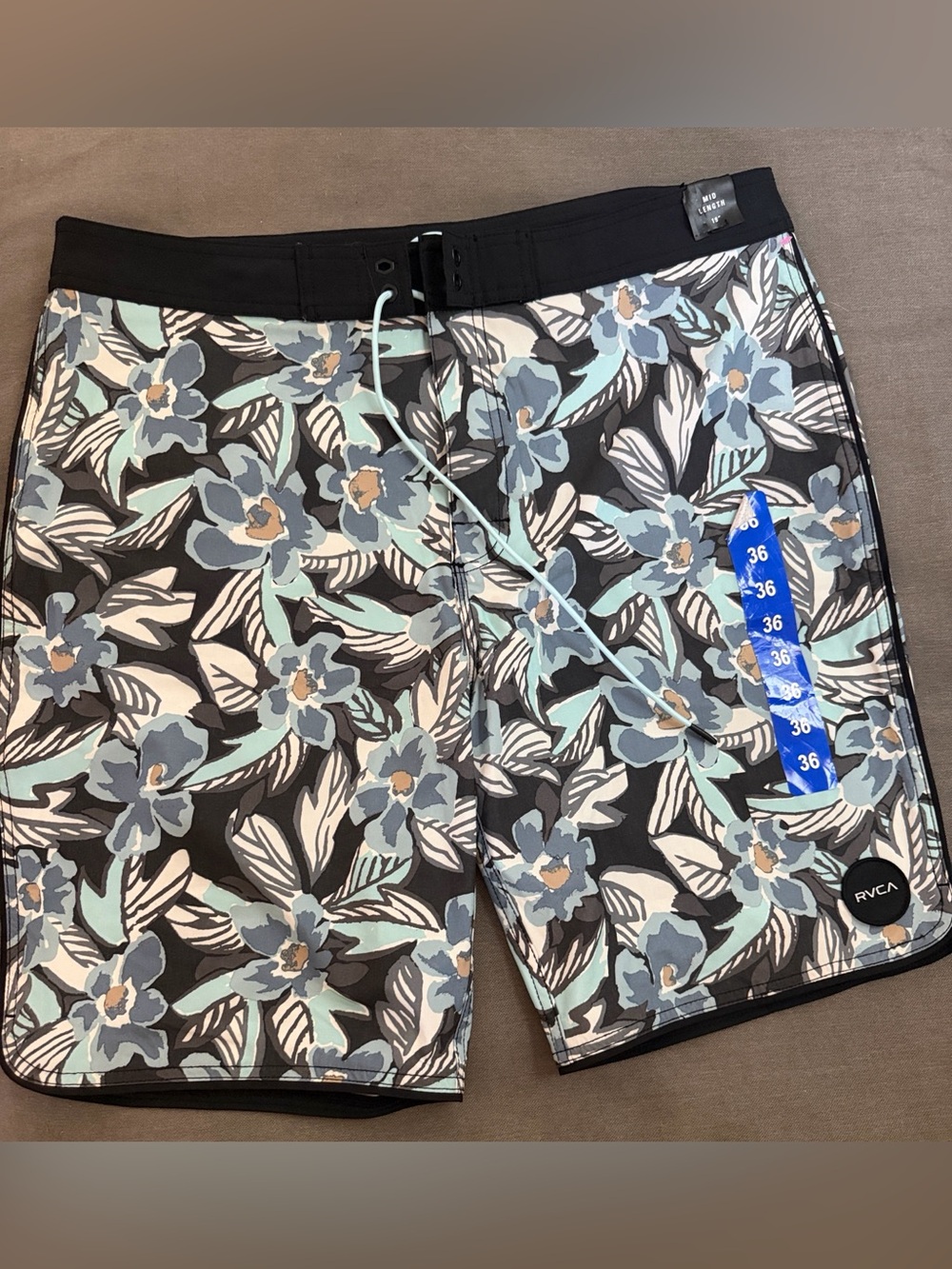 RVCA Black Floral Board Shorts with Light Blue Accents
Size 36
New with tags